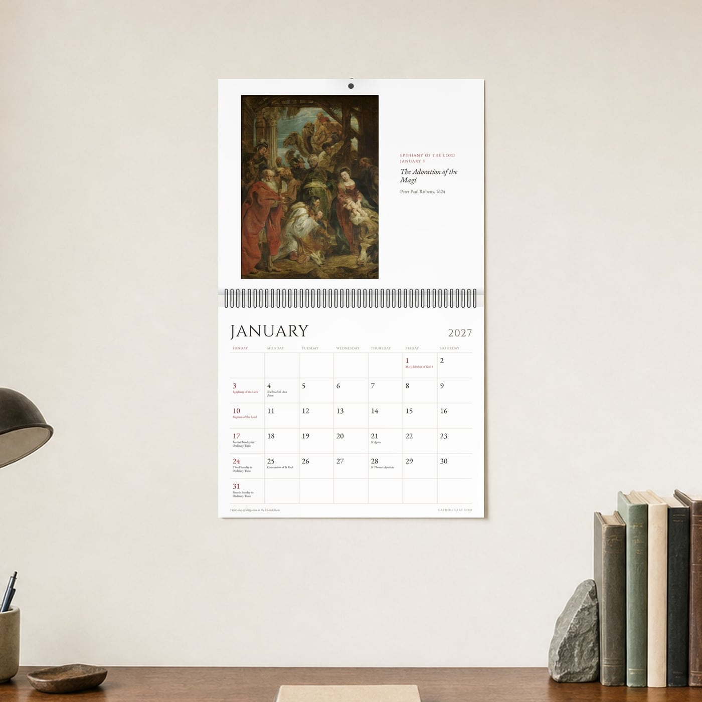 The calendar hanging open at January, above a desk